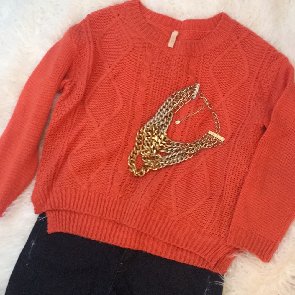 Orange sweater.